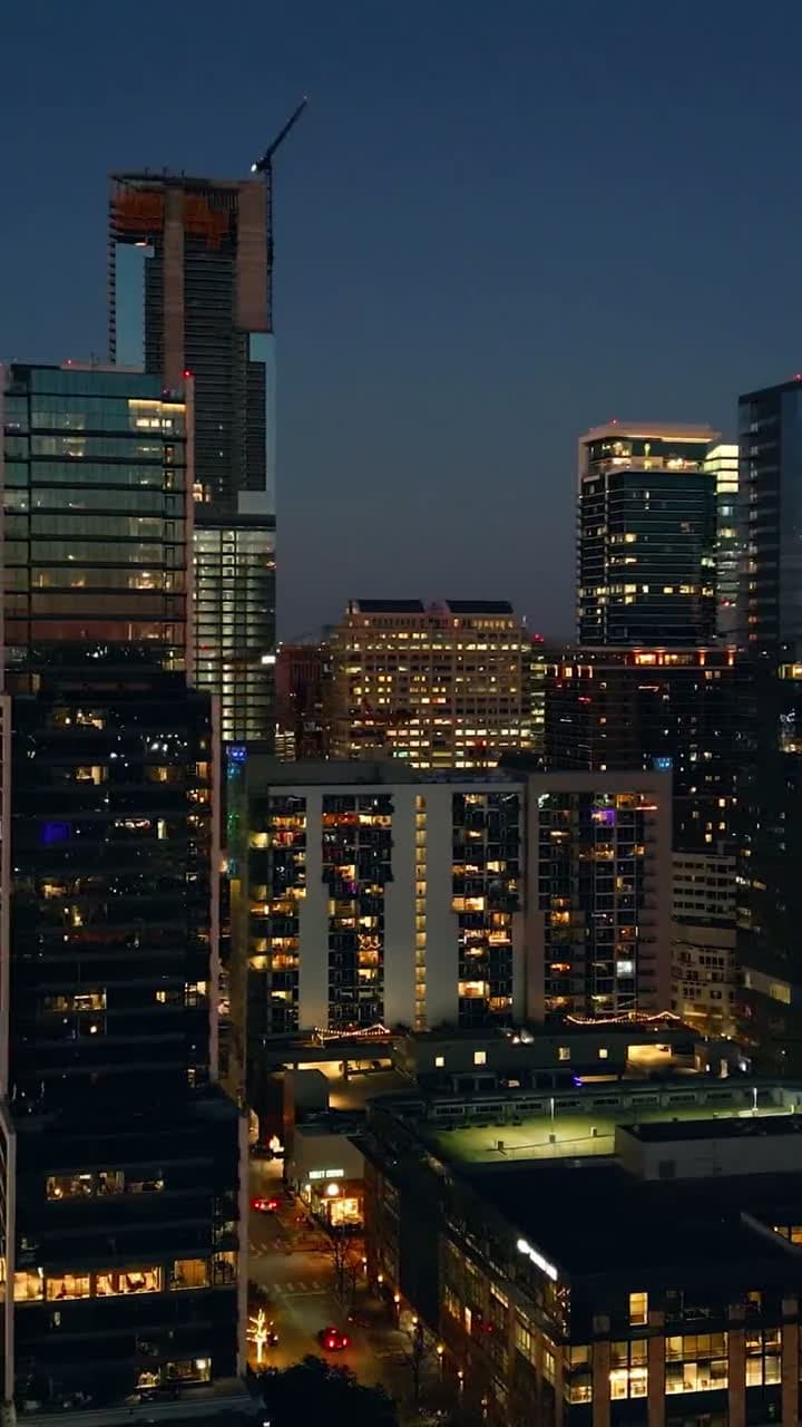 Aerial view of a financial-district skyline at golden hour